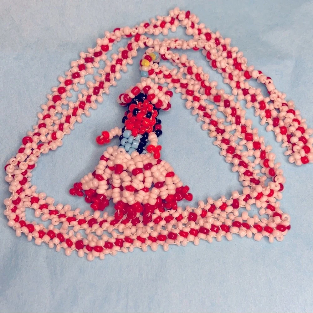 Native American, glass beaded doll pendant.